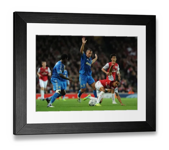 Framed Print : Theo Walcott Outmaneuvers Nicolas N'Koulou and Benoit Cherou as Arsenal Takes on Olympique de Marseille in the UEFA Champions League Framed Print : Theo Walcott Outmaneuvers Nicolas N'Koulou and Benoit Cherou as Arsenal Takes on Olympique de Marseille in the UEFA Champions League