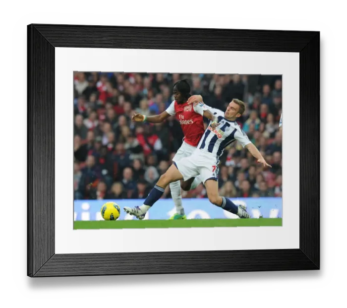 Framed Print : Arsenal vs. West Bromwich Albion: Gervinho vs. James Morrison Tangle in Premier League Clash Framed Print : Arsenal vs. West Bromwich Albion: Gervinho vs. James Morrison Tangle in Premier League Clash