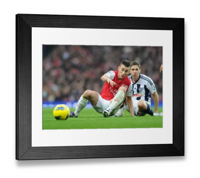 Framed Print : Arsenal's Koscielny Tackles Gera in Intense Arsenal vs. West Bromwich Albion Clash (2011-12)