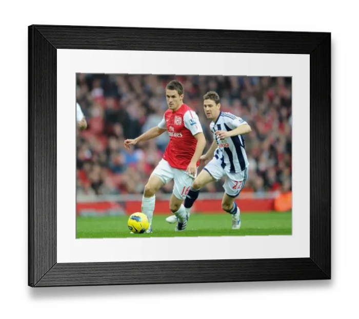 Framed Print : Arsenal's Triumph: Ramsey's Brilliance Leads to 3-0 Victory over West Bromwich Albion in the Premier League Framed Print : Arsenal's Triumph: Ramsey's Brilliance Leads to 3-0 Victory over West Bromwich Albion in the Premier League