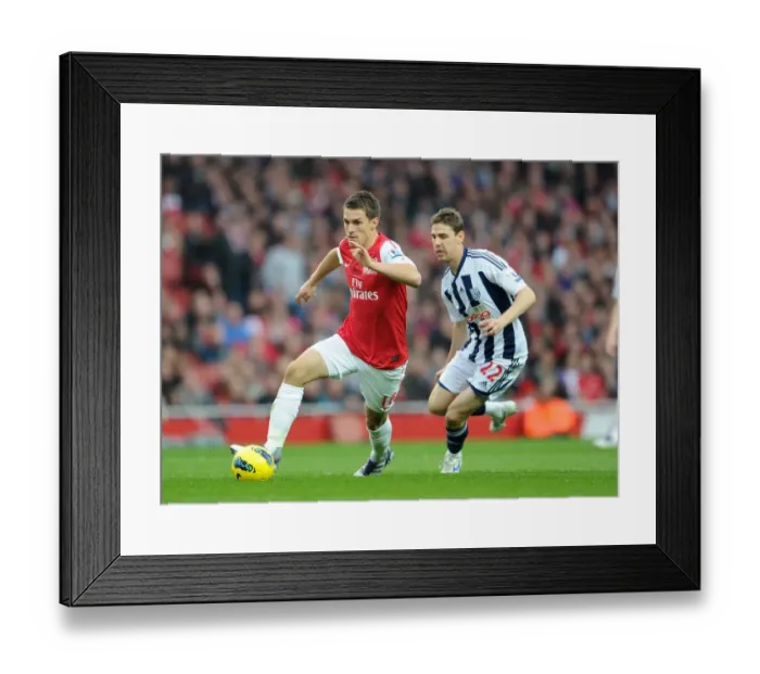 Framed Print : Aaron Ramsey (Arsenal) Zoltan Gera (WBA). Arsenal 3: 0 West Bromwich Albion Framed Print : Aaron Ramsey (Arsenal) Zoltan Gera (WBA). Arsenal 3: 0 West Bromwich Albion