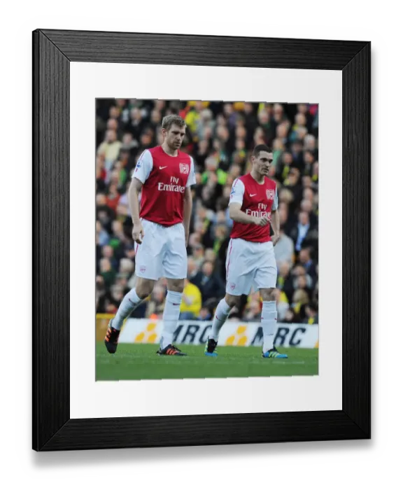 Framed Print : Mertesacker and Vermaelen: A Defensive Duo in Action for Arsenal vs Norwich City (2011-12)