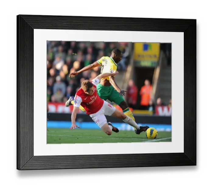 Framed Print : Aaron Ramsey Tackles Leon Barnett: Intense Moment from Norwich City vs. Arsenal (2011-12)