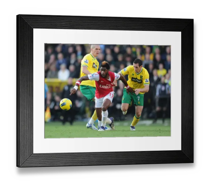 Framed Print : Alex Song Outmaneuvers Andrew Crofts: Norwich City vs Arsenal, Premier League 2011-12 Framed Print : Alex Song Outmaneuvers Andrew Crofts: Norwich City vs Arsenal, Premier League 2011-12