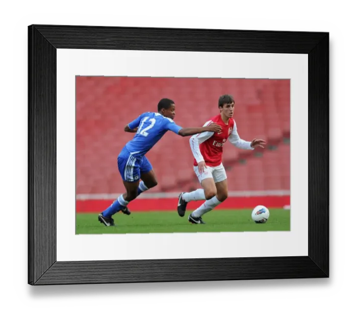 Framed Print : Arsenal's Alban Bunjaku Scores Against Chelsea's Archange Nkumu in U18 Friendly at Emirates Stadium (2011) Framed Print : Arsenal's Alban Bunjaku Scores Against Chelsea's Archange Nkumu in U18 Friendly at Emirates Stadium (2011)