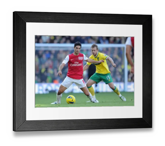 Framed Print : Arsenal vs. Norwich: Mikel Arteta vs. David Fox - Premier League Clash at Carrow Road (November 19, 2011)