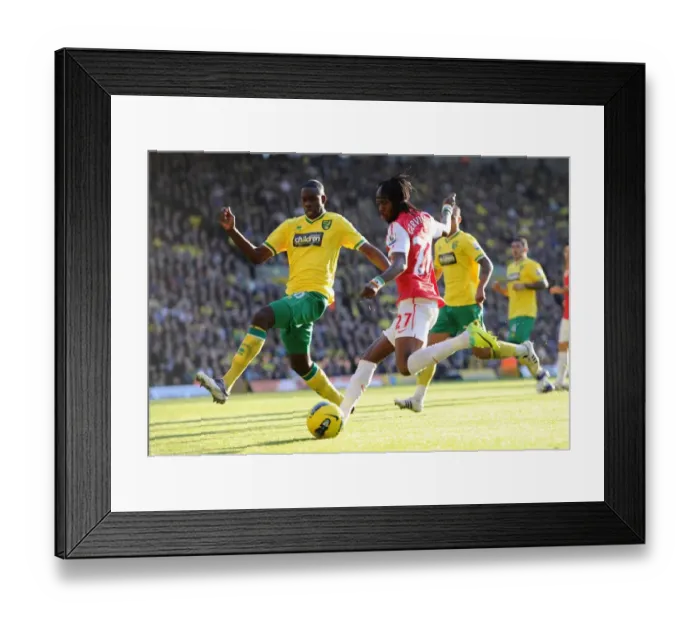 Framed Print : Gervinho vs. Barnett: Clash at Carrow Road - Premier League Showdown, Norwich City vs. Arsenal (19 / 11 / 11) Framed Print : Gervinho vs. Barnett: Clash at Carrow Road - Premier League Showdown, Norwich City vs. Arsenal (19 / 11 / 11)