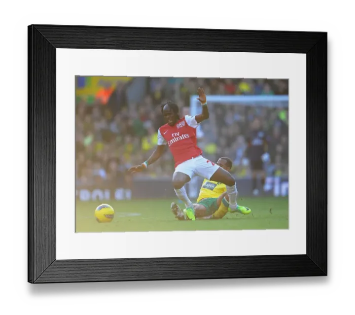 Framed Print : Gervinho vs. Kyle Naughton: A Battle at Carrow Road - Premier League Showdown, Arsenal vs. Norwich City, 19 / 11 / 11 Framed Print : Gervinho vs. Kyle Naughton: A Battle at Carrow Road - Premier League Showdown, Arsenal vs. Norwich City, 19 / 11 / 11