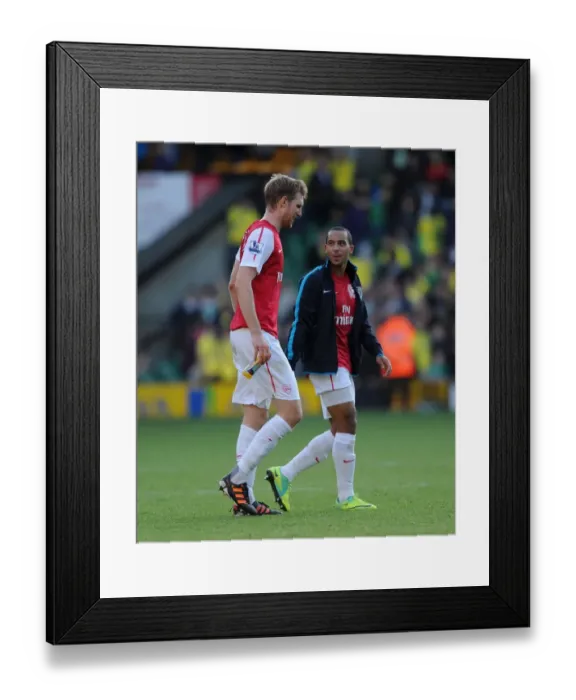 Framed Print : Arsenal Duo Per Mertesacker and Theo Walcott Departing the Field: Norwich City vs. Arsenal, Premier League, 2011 Framed Print : Arsenal Duo Per Mertesacker and Theo Walcott Departing the Field: Norwich City vs. Arsenal, Premier League, 2011
