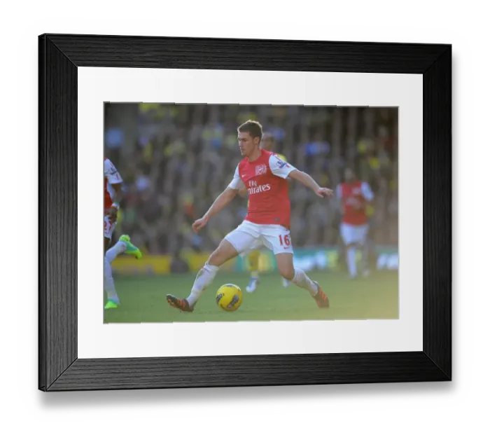 Framed Print : Aaron Ramsey (Arsenal). Norwich City v Arsenal. Barclays Premier League Framed Print : Aaron Ramsey (Arsenal). Norwich City v Arsenal. Barclays Premier League