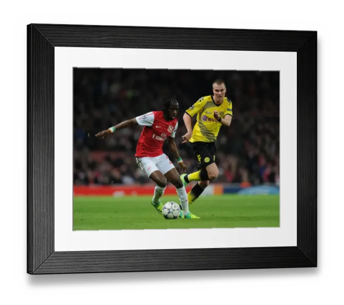 Framed Print : Clash of Wings: Gervinho vs. Grosskreutz in Arsenal vs. Borussia Dortmund UEFA Champions League Framed Print : Clash of Wings: Gervinho vs. Grosskreutz in Arsenal vs. Borussia Dortmund UEFA Champions League