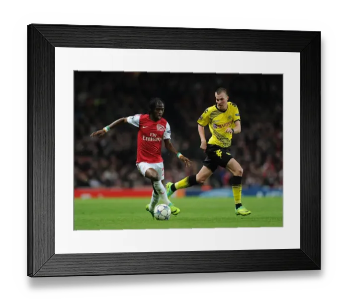 Framed Print : Gervinho vs. Kevin Grosskreutz: Battle at the Emirates - Arsenal vs. Borussia Dortmund, UEFA Champions League, 2011 Framed Print : Gervinho vs. Kevin Grosskreutz: Battle at the Emirates - Arsenal vs. Borussia Dortmund, UEFA Champions League, 2011