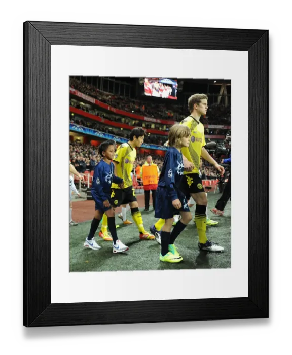 Framed Print : Champions League Clash: Arsenal FC vs Borussia Dortmund - Player Escorts (2011-12) Framed Print : Champions League Clash: Arsenal FC vs Borussia Dortmund - Player Escorts (2011-12)