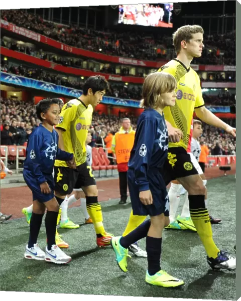 LONDON, ENGLAND - NOVEMBER 23: Player escorts before the UEFA Champions League Group F match between Arsenal FC and Borussia Dortmund at Emirates Stadium on November 23, 2011 in London, England. (Photo by David Price  /  Arsenal FC via