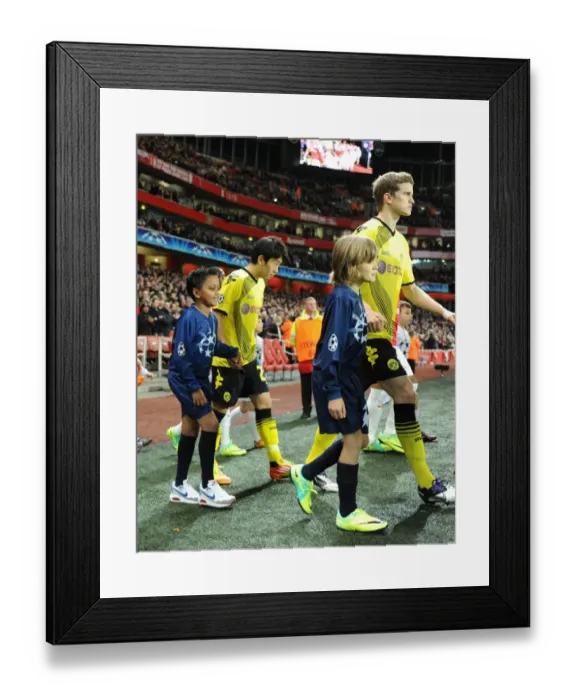 Framed Print : LONDON, ENGLAND - NOVEMBER 23: Player escorts before the UEFA Champions League Group F match between Arsenal FC and Borussia Dortmund at Emirates Stadium on November 23, 2011 in London, England. (Photo by David Price / Arsenal FC via Framed Print : LONDON, ENGLAND - NOVEMBER 23: Player escorts before the UEFA Champions League Group F match between Arsenal FC and Borussia Dortmund at Emirates Stadium on November 23, 2011 in London, England. (Photo by David Price / Arsenal FC via