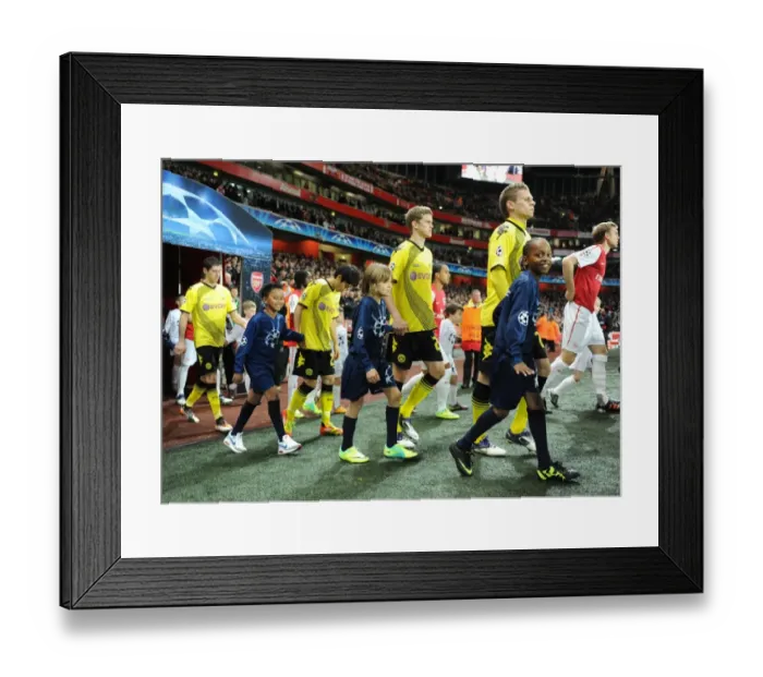 Framed Print : Arsenal vs Borussia Dortmund: Champion League Showdown at Emirates Stadium (2011-12) - Player Escorts