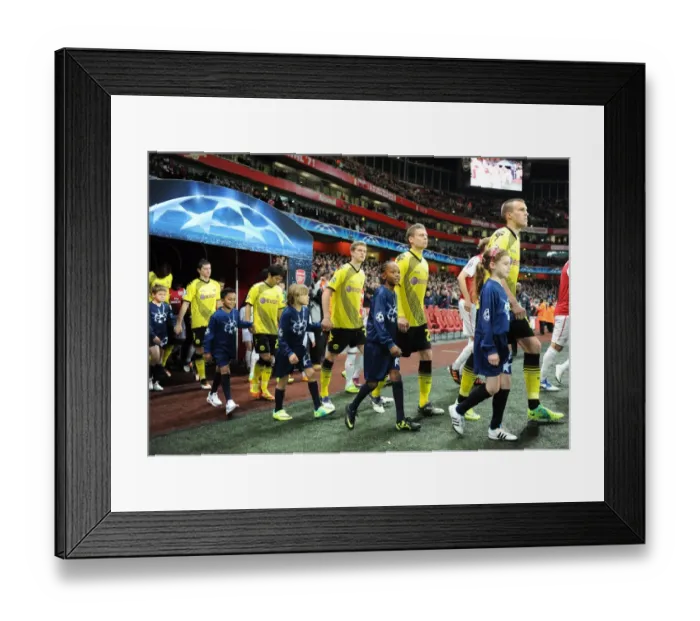 Framed Print : Arsenal FC vs. Borussia Dortmund: Player Escorts in Champions League Showdown at Emirates Stadium (2011-12)