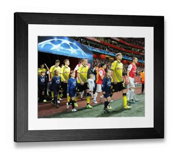 Framed Print : Arsenal vs Borussia Dortmund: Player Escorts in Champions League Clash at Emirates Stadium (2011-12) Framed Print : Arsenal vs Borussia Dortmund: Player Escorts in Champions League Clash at Emirates Stadium (2011-12)