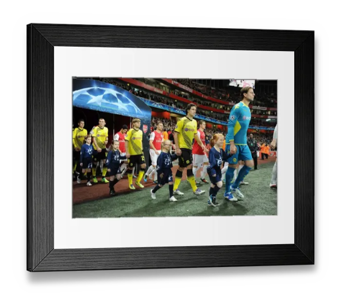 Framed Print : Arsenal vs Borussia Dortmund: Champion League Showdown at Emirates Stadium (2011-12) - Player Escorts