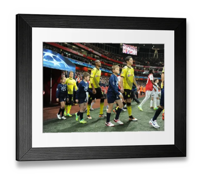 Framed Print : Arsenal vs Borussia Dortmund: Champion League Showdown at Emirates Stadium (2011-12) - Player Escorts Framed Print : Arsenal vs Borussia Dortmund: Champion League Showdown at Emirates Stadium (2011-12) - Player Escorts