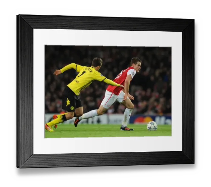 Framed Print : Aaron Ramsey vs. Felipe Santana: Clash at the Emirates - Arsenal v Borussia Dortmund, UEFA Champions League, 2011
