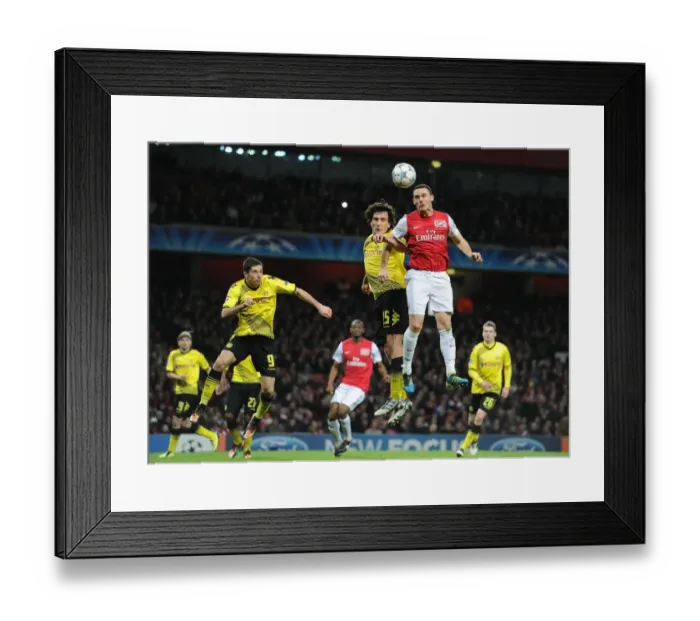 Framed Print : Thomas Vermaelen Outmaneuvers Mats Hummels: Arsenal's Goal Against Borussia Dortmund in the 2011-12 Champions League Framed Print : Thomas Vermaelen Outmaneuvers Mats Hummels: Arsenal's Goal Against Borussia Dortmund in the 2011-12 Champions League