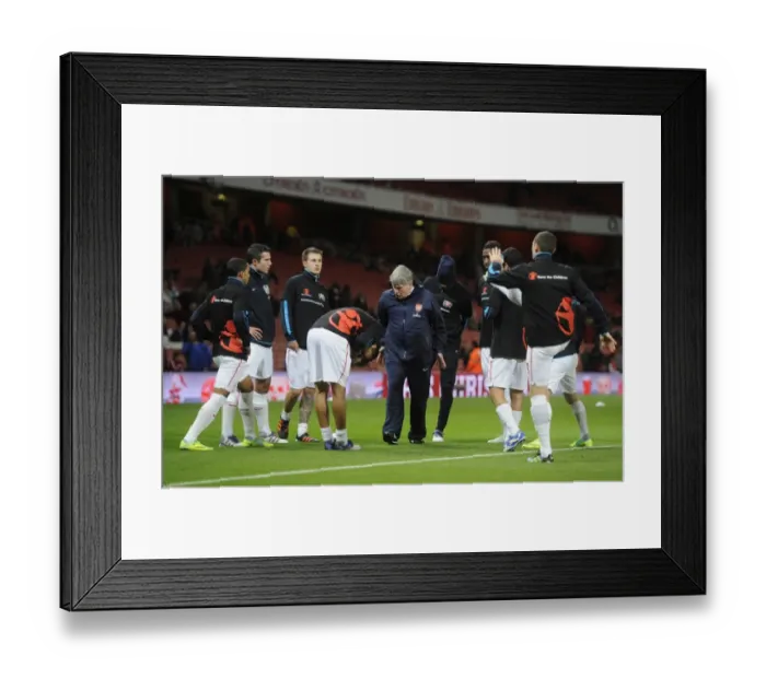 Framed Print : Arsenal Team Warm-Up before the Barclays Premier League Match