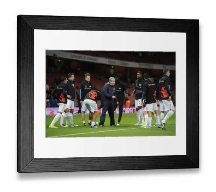 Framed Print : The Arsenal team warm up before the Barclays Premier League match between Arsenal Framed Print : The Arsenal team warm up before the Barclays Premier League match between Arsenal