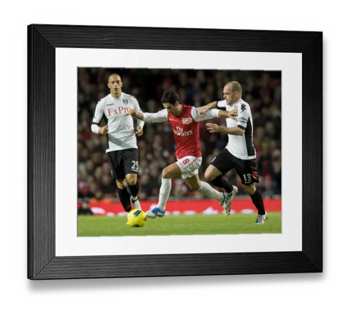 Framed Print : Mikel Arteta of Arsenal breaks past Danny Murphy of Fulham during the Barclays Premier League match between Arsenal and Fulham at Emirates Stadium on November 26, 2011 in London, England. Credit; Arsenal