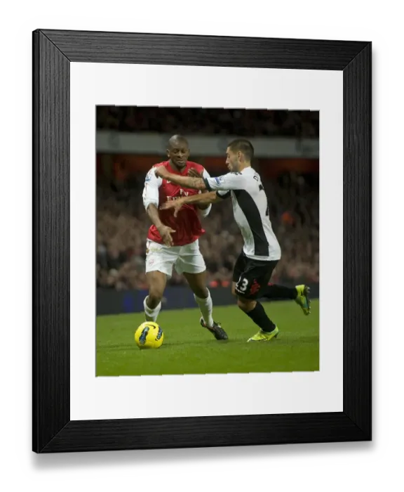 Framed Print : Arsenal's Abou Diaby Faces Off Against Fulham's Clint Dempsey during the 2011-12 Premier League Match