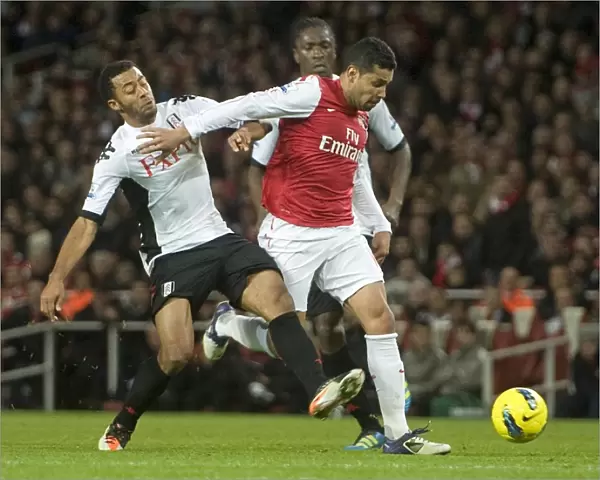 Andre Santos of Arsenal takes on Mousa Dembele of Fulham during the Barclays Premier League match between Arsenal and Fulham at Emirates Stadium on November 26, 2011 in London, England. Credit; Arsenal
