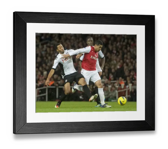 Framed Print : Andre Santos of Arsenal takes on Mousa Dembele of Fulham during the Barclays Premier League match between Arsenal and Fulham at Emirates Stadium on November 26, 2011 in London, England. Credit; Arsenal