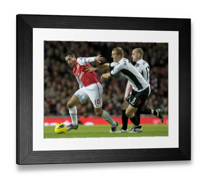 Framed Print : Robin van Persie of Arsenal breaks past Brede Hangeland of Fulham during the Barclays Premier League match between Arsenal and Fulham at Emirates Stadium on November 26, 2011 in London, England. Credit; Arsenal
