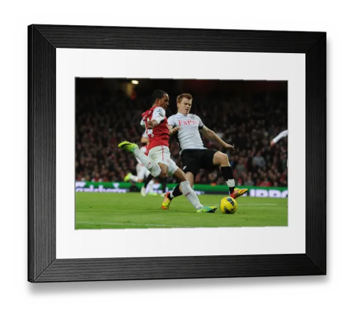 Framed Print : Theo Walcott vs. John Arne Riisse: A Battle at Emirates Stadium (Arsenal v Fulham, 2011-12) Framed Print : Theo Walcott vs. John Arne Riisse: A Battle at Emirates Stadium (Arsenal v Fulham, 2011-12)