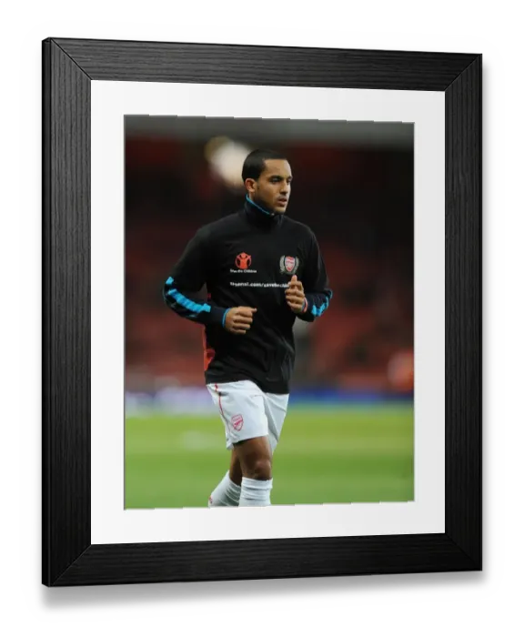 Framed Print : Theo Walcott of Arsenal before the Barclays Premier League match between Arsenal