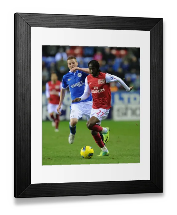 Framed Print : Gervinho Breaks Past McCarthy: Wigan Athletic vs. Arsenal, Premier League 2011-12