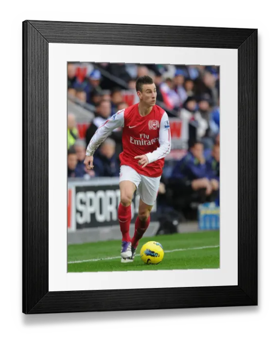 Framed Print : Focused Koscielny in Wigan Athletic vs Arsenal Clash (2011-12)