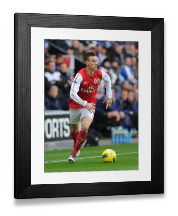 Framed Print : Laurent Koscielny Focused: Wigan Athletic vs Arsenal, Premier League 2011-12