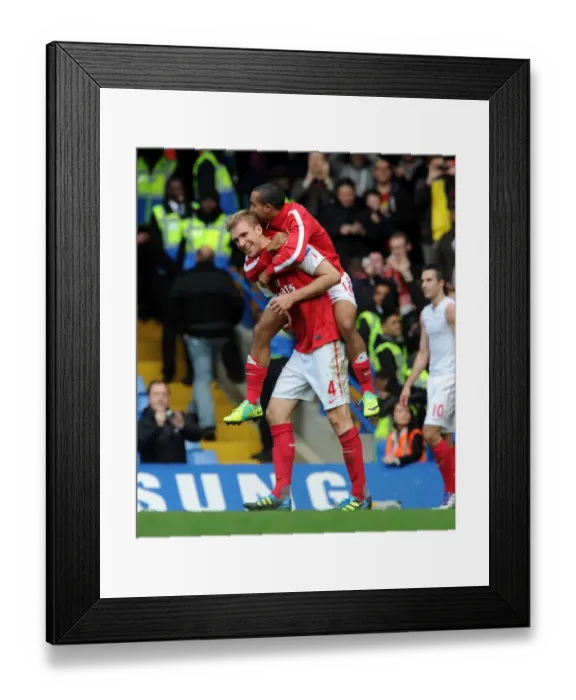 Framed Print : Arsenal's Glorious Comeback: Per Mertesacker and Theo Walcott Celebrate a 5-3 Victory Over Chelsea