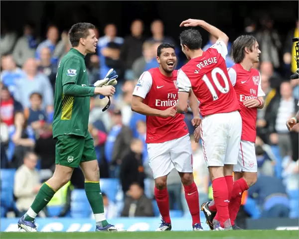 Robin van Persie, Andre Santos and Wojciech Szczesny (Arsenal) celebrate after the match