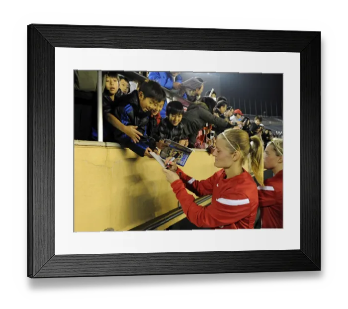 Framed Print : Arsenal Ladies vs. INAC Kobe: Unforgettable 1:1 Charity Match at Nishigaoka Stadium, Tokyo (30 / 11 / 11) - Katie Chapman Amidst Cheering Fans