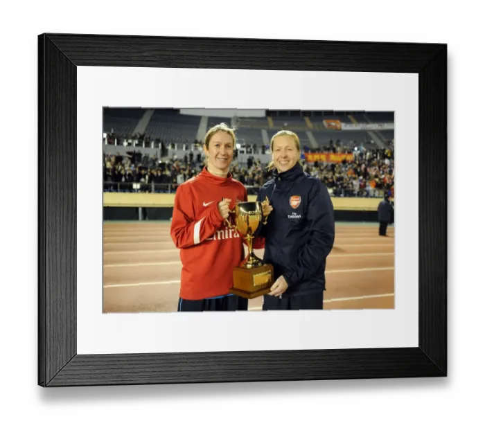 Framed Print : Arsenal Ladies and INAC Kobe Draw in Charity Match at Nishigaoka Stadium, Tokyo (30 / 11 / 11): Celebrating with the Trophy (Ciara Grant and Jayne Ludlow)
