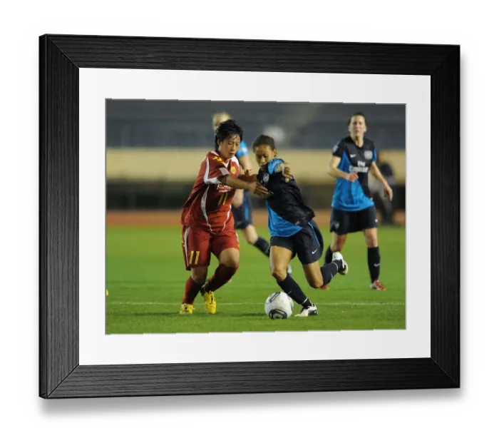 Framed Print : Arsenal Ladies Rachel Yankey vs. Megumi Takase: A 1-1 Draw in Charity Match between Arsenal Ladies and INAC Kobe at Nishigaoka Stadium, Tokyo (November 30, 2011)