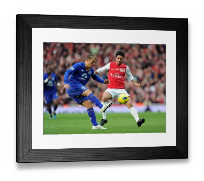 Framed Print : Mikel Arteta (Arsenal) Philip Neville (Everton). Arsenal 1: 0 Everton. Barclays Premier League Framed Print : Mikel Arteta (Arsenal) Philip Neville (Everton). Arsenal 1: 0 Everton. Barclays Premier League