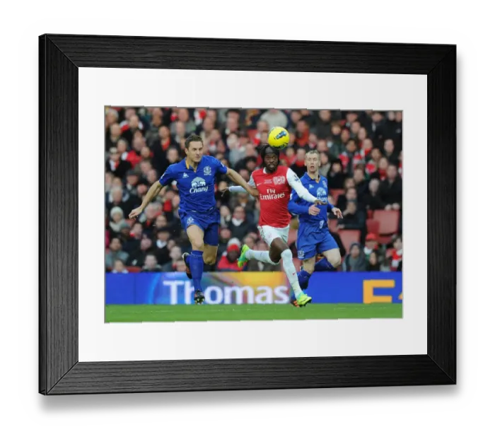 Framed Print : Gervinho Outmaneuvers Jagielka: Arsenal vs. Everton, Premier League 2011-12