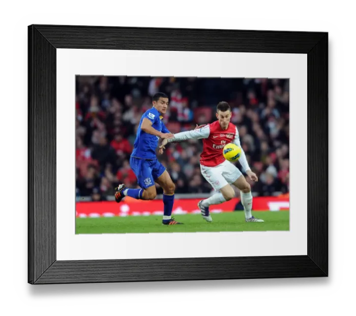 Framed Print : Arsenal vs. Everton: Koscielny vs. Cahill - Intense Battle in the Premier League Framed Print : Arsenal vs. Everton: Koscielny vs. Cahill - Intense Battle in the Premier League