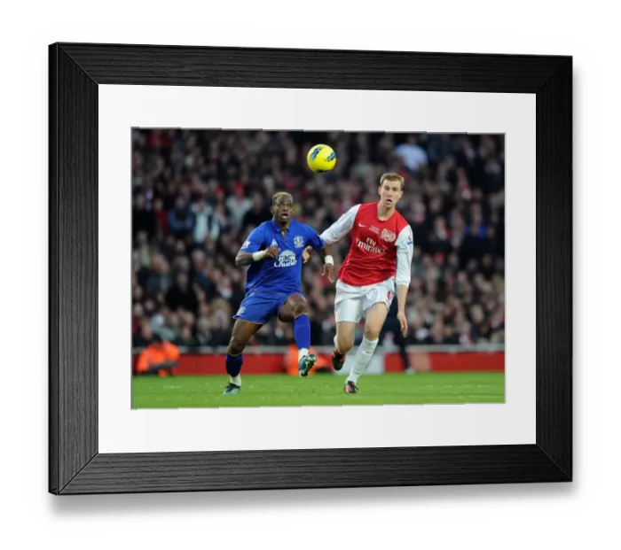 Framed Print : Arsenal vs. Everton: Per Mertesacker vs. Louis Saha in Intense Premier League Clash