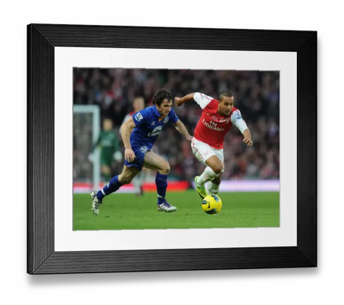 Framed Print : Theo Walcott Outmaneuvers Leighton Baines in Arsenal vs. Everton Clash (2011-12)