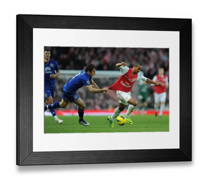 Framed Print : Theo Walcott Outmaneuvers Leighton Baines: Arsenal vs. Everton, Premier League, 2011-12