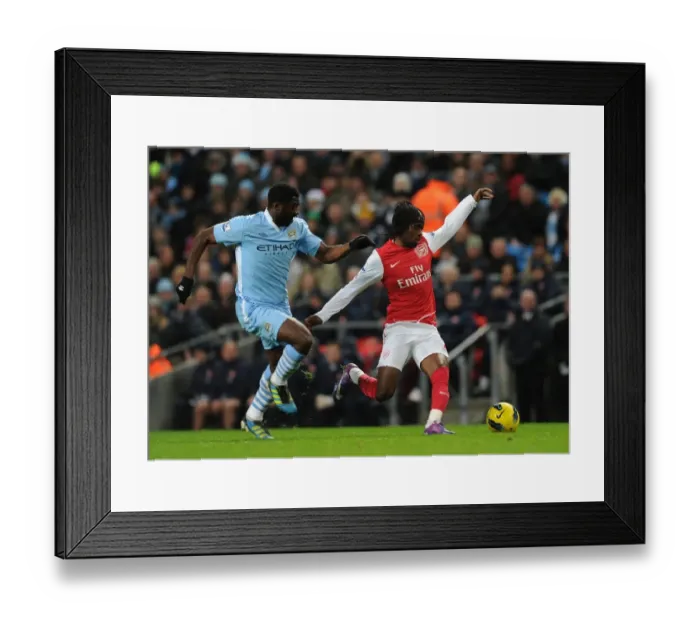 Framed Print : Gervinho Dashes Past Kolo Toure: Manchester City vs. Arsenal, Premier League Showdown (2011-12) Framed Print : Gervinho Dashes Past Kolo Toure: Manchester City vs. Arsenal, Premier League Showdown (2011-12)